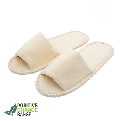 Pair of beige open-toe eco-friendly slippers labeled Positive Change Range, on a white background
