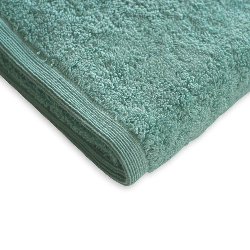 Close-up of ultra-soft frost-colored towel fabric showing its plush texture