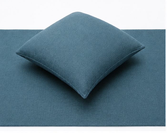 blue hotel bed cushion and runner