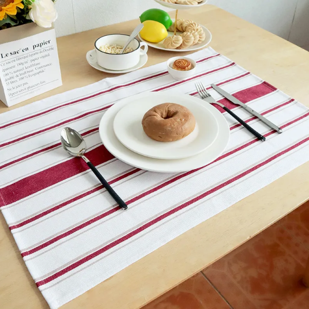 Folded white cotton tea towel with a clean, minimal design for kitchen and dish drying use