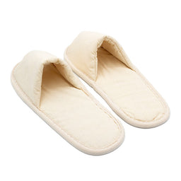 Pair of beige open-toe fabric slippers with simple design, placed side by side on a white background.