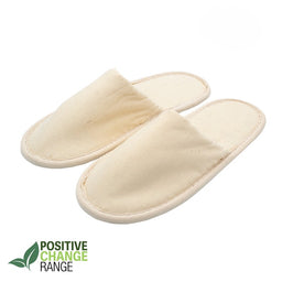 Pair of beige eco-friendly fabric slippers with closed toes, labeled Positive Change Range on white background.