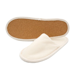 Pair of beige fabric slippers, one showing the cork sole and the other displaying the closed-toe upper.