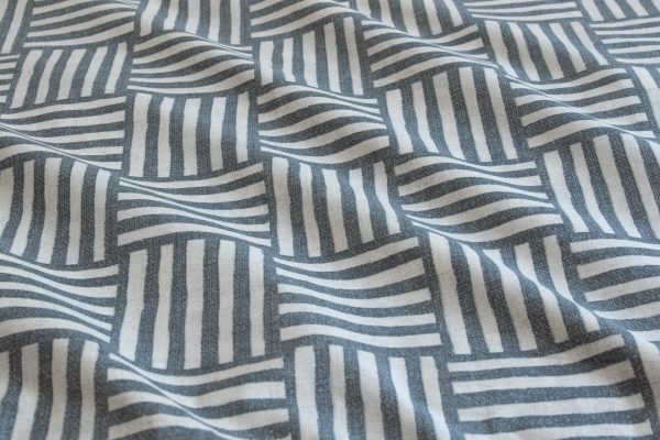 Close-up of Fletcher quilt cover fabric showing blue and white geometric pattern in detail