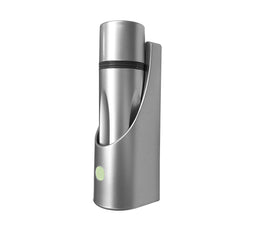 Silver cylindrical flashlight standing upright in a matching silver charging base with a round button