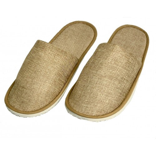 Pair of beige open-back indoor slippers with textured fabric upper and soft white soles, displayed on white background.