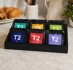 T2 tea caddy for hotel guest room with six compartments.