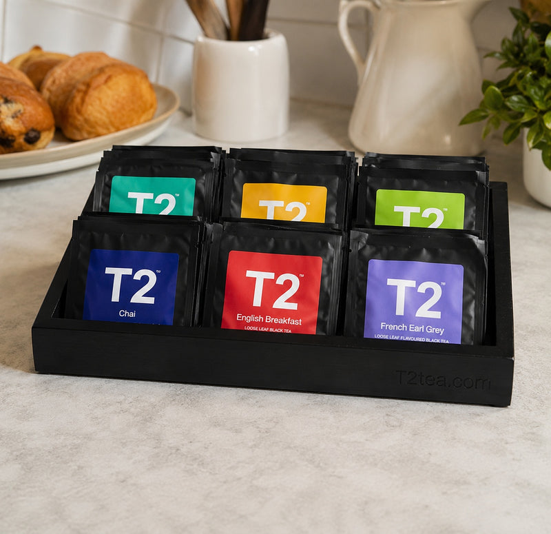 T2 tea caddy for hotel guest room with six compartments.