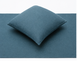 blue hotel bed cushion and runner