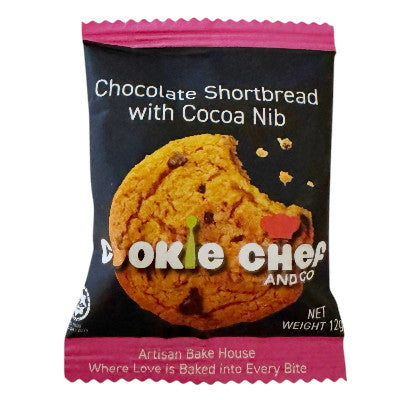Chocolate cookie with chunks of chocolate, displayed on a white background.