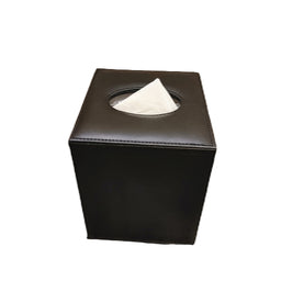Black rectangular tissue box with a white tissue protruding from the circular opening on top