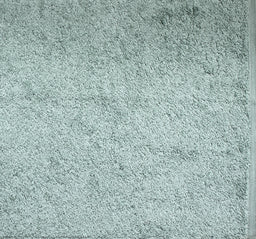 Frost-colored ultra towel folded neatly, highlighting its soft and plush texture