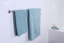 tack of frost-colored ultra towels neatly folded, showcasing soft and plush texture