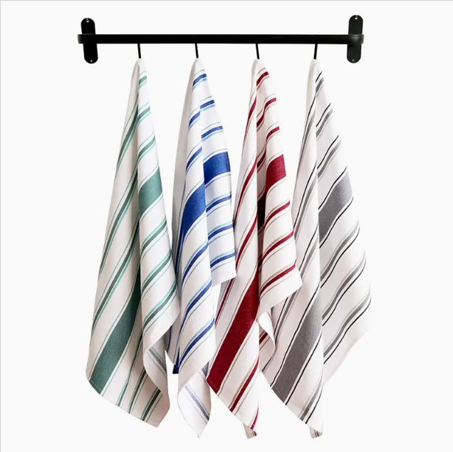 Plain white cotton tea towel neatly folded, ideal for kitchen cleaning and drying dishes.