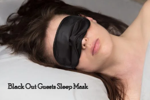 Black sleep mask made of soft fabric, designed for comfortable light blocking during sleep.