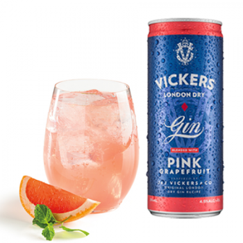 Vickers London Dry Gin with Pink Grapefruit can beside a glass of pink drink with ice, grapefruit wedge, and mint